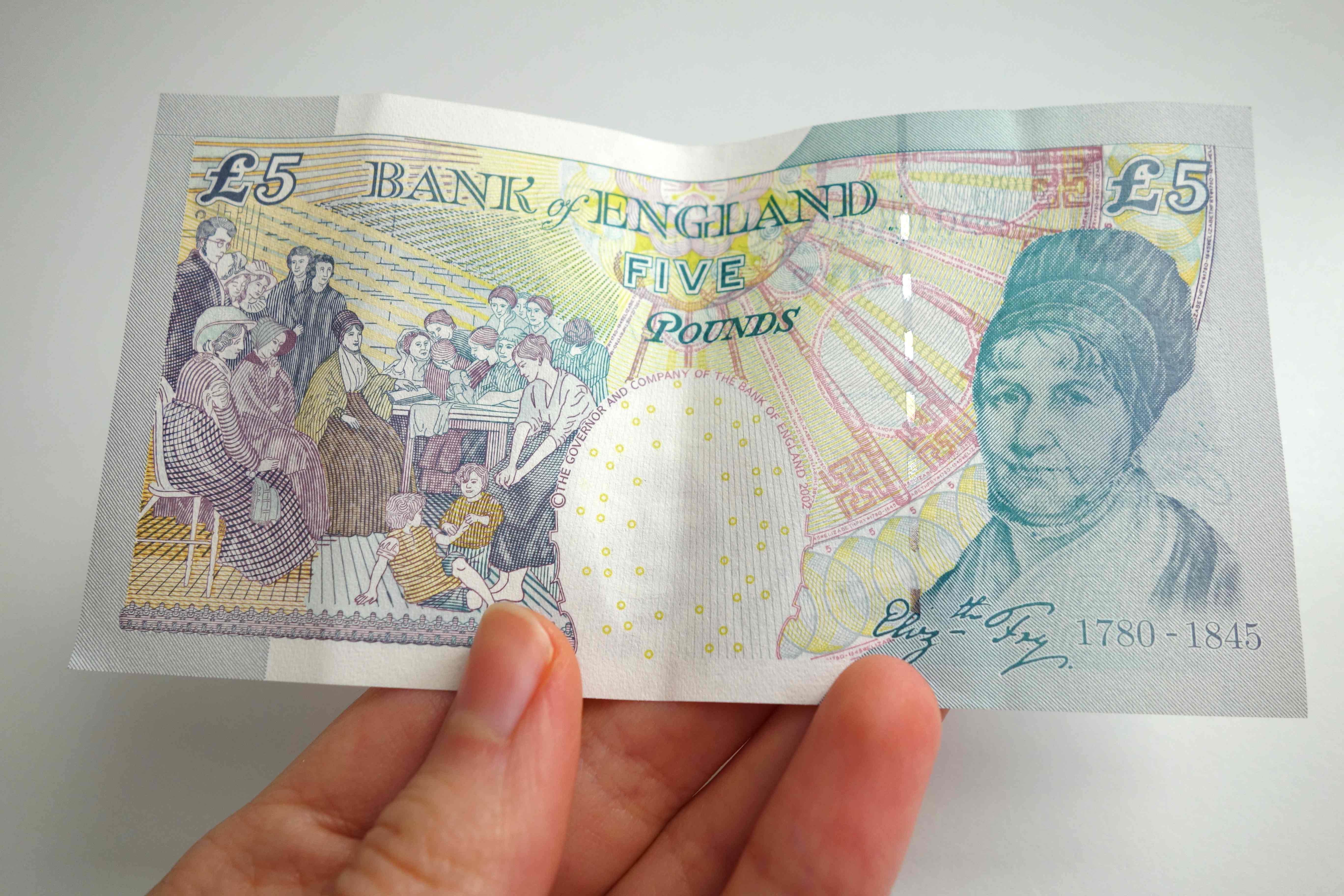 UK money British 5 pound note five fiver with picture of Elizabeth Fry